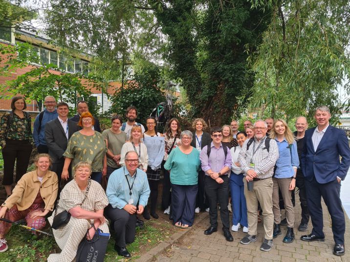 Nottingham Green Partnership members in front of heron artwork installed at Nottingham canal
